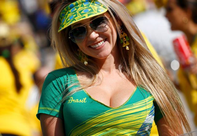 A Brazilian fan attends the opening ceremony of the 2014 World Cup at the Corinthians arena in Sao Paulo