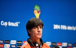 Germany's coach Loew listens to a question during a news conference at the Maracana stadium in Rio de Janeiro