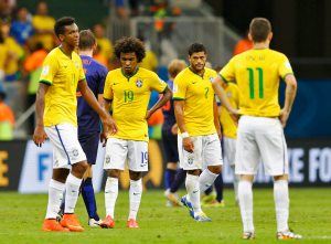 (L-R) Brazil's Jo, Willian, Hulk and Oscar react after they lost their 2014 World Cup third-place playoff against the Netherlands at the Brasilia national stadium in Brasilia