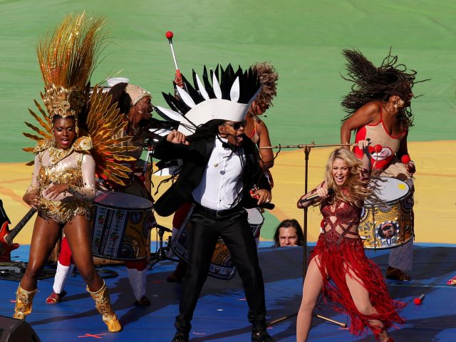 Shakira and Carlinhos Brown perform during the 2014 World Cup closing ceremony at the Maracana stadium in Rio de Janeiro