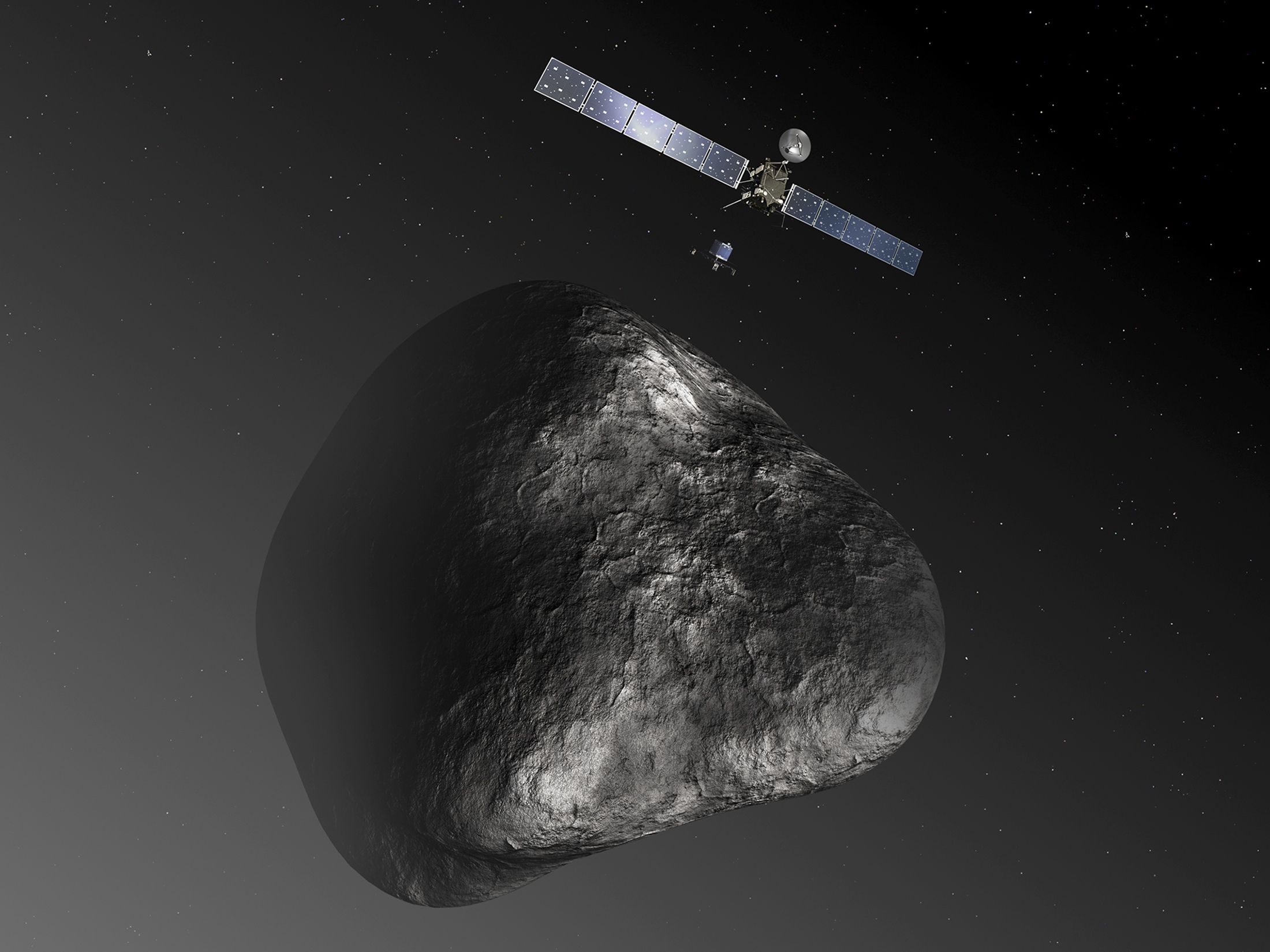 A handout image of an artist's impression, not to scale, of the Rosetta orbiter deploying the Philae lander to comet 67P/Churyumov-Gerasimenko