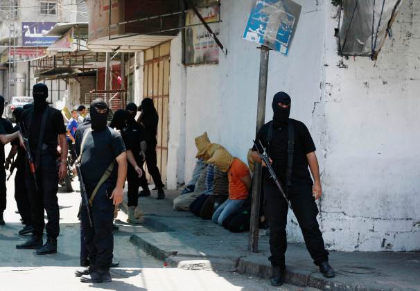 Hamas militants surround Palestinians suspected of collaborating with Israel in Gaza City