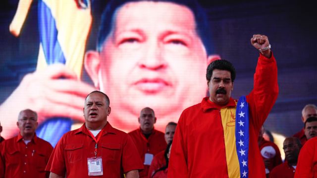 Handout picture of Maduro and Cabello singing the national anthem during the closing of the United Socialist party congress in Caracas