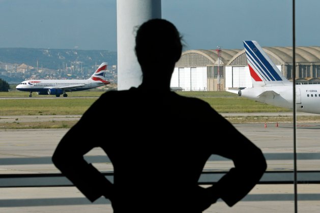 An Air France staff member looks at the Marseille-Provence airport tarmac on the second day of an Air France one-week strike at Marseille airport
