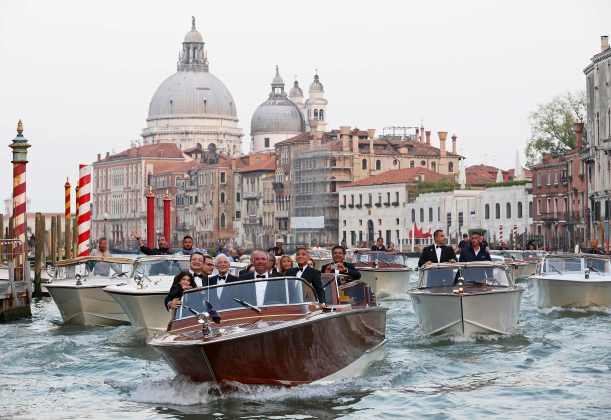 U.S. actor Clooney travels on a taxi boat to the venue of a gala dinner ahead of his official wedding ceremony in Venice