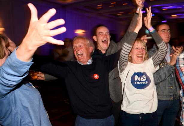Supporters from the "No" Campaign react to a declaration in their favour, in Glasgow, Scotland