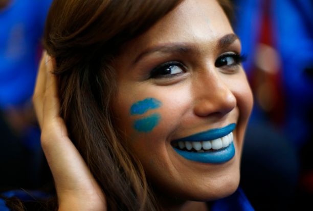 Miss Venezuela Debora Menicucci wears face paint during the Miss World sports competition at the Lee Valley sports complex in north London