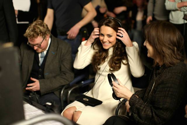 Britain's Catherine, Duchess of Cambridge watches live filming of a scene during a visit to the set of Downton Abbey at Ealing Studios, west of London