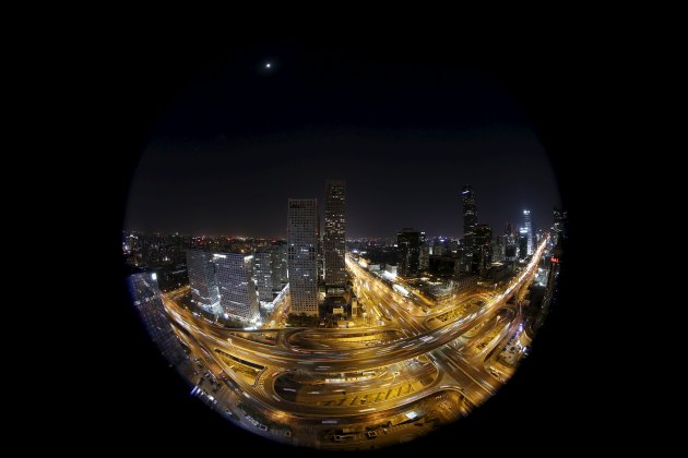 A general view shows Yintai Centre buildings, with their red light on top turned off, during Earth Hour in Beijing's central business district