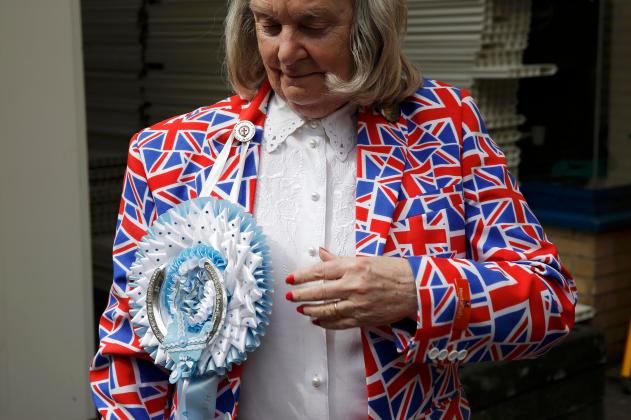 A fan of the royal family wears a union flag themed blazer outside the Lindo Wing of St Mary's hospital in Londo