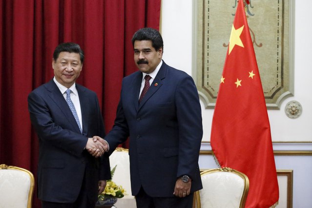 File photo of China's President Xi with Venezuela's President Maduro at a meeting in Miraflores Palace in Caracas