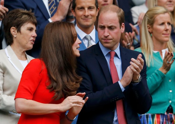 Britain's Catherine Duchess of Cambridge and Prince William (R) applaud as Andy Murray of Britain comes out to play his match against Vasek Pospisil of Canada at the Wimbledon Tennis Championships in London