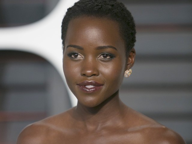 (FILES) This February 22, 2015 file photo shows Lupita Nyong'o as she arrives at the 2015 Vanity Fair Oscar Party in Beverly Hills, California. Oscar-winning Hollywood actress Lupita Nyong'o will make her New York stage debut later this year, starring in a play set amid the horrors of the Liberian civil war. The Public Theater in Manhattan said the production of "Eclipsed" would run from September 29 to November 8. Nyong'o, 32, will play "The Girl" in what the theater called "a powerful story of survival and resilience" about women finding and testing their own strength in a hostile world. AFP PHOTO/ADRIAN SANCHEZ-GONZALEZ