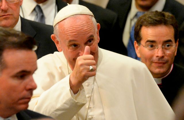 Pope Francis gives a thumbs up as he departs following The Evening Prayer (Vespers) at St. Patrick's Cathedral in New York, September 24, 2015. Pope Francis is on a five-day trip to the USA, which includes stops in Washington DC, New York and Philadelphia, after a three-day stay in Cuba. REUTERS/Robert Deutsch/USA Today/POOL