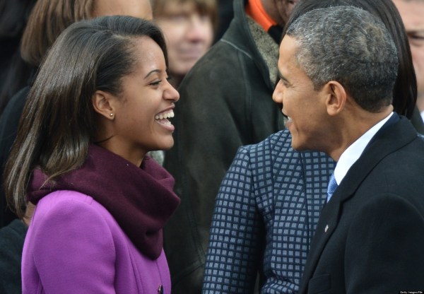President Barack Obama is greeted by daughter Malia as he arrives for the 57th Presidential Inauguration ceremonial swearing-in at the US Capitol on January 21, 2013 in Washington, DC. AFP PHOTO/Jewel Samad        (Photo credit should read JEWEL SAMAD/AFP/Getty Images)