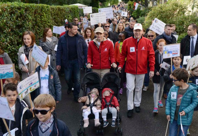 Prince Albert II of Monaco and his wife Princess Charlene of Monaco with their twins Prince Jacques and Princess Gabriella participate in a climate march in Monaco, November 29, 2015 ahead of the World Climate Change Conference 2015 (COP21) held in Le Bourget near Paris.   REUTERS/Jean-Pierre Amet