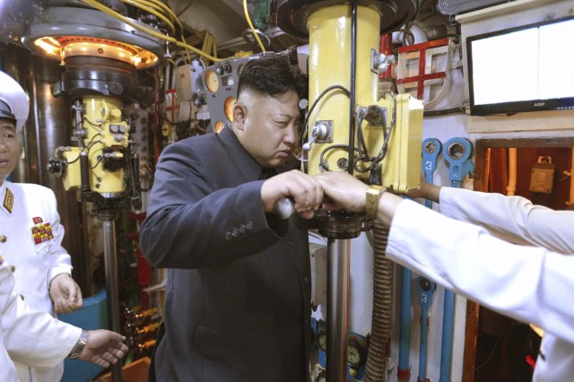 North Korean leader Kim Jong Un (C) looks through a periscope of a submarine during his inspection of the Korean People's Army (KPA) Naval Unit 167 in this undated file photo released by North Korea's Korean Central News Agency (KCNA) in Pyongyang June 16, 2014. North Korea said it had successfully conducted a test of a miniaturised hydrogen nuclear device on the morning of January 6, 2016, marking a significant advance in the isolated state's strike capabilities and raising alarm bells in Japan and South Korea.   REUTERS/KCNA/Files ATTENTION EDITORS - THIS PICTURE WAS PROVIDED BY A THIRD PARTY. REUTERS IS UNABLE TO INDEPENDENTLY VERIFY THE AUTHENTICITY, CONTENT, LOCATION OR DATE OF THIS IMAGE. FOR EDITORIAL USE ONLY. NOT FOR SALE FOR MARKETING OR ADVERTISING CAMPAIGNS. NO THIRD PARTY SALES. NOT FOR USE BY REUTERS THIRD PARTY DISTRIBUTORS. SOUTH KOREA OUT. NO COMMERCIAL OR EDITORIAL SALES IN SOUTH KOREA. THIS PICTURE IS DISTRIBUTED EXACTLY AS RECEIVED BY REUTERS, AS A SERVICE TO CLIENTS. FROM THE FILES PACKAGE â€˜NORTH KOREA NUCLEAR TEST'SEARCH â€˜KOREA NUCLEARâ€™ FOR ALL 20 IMAGES