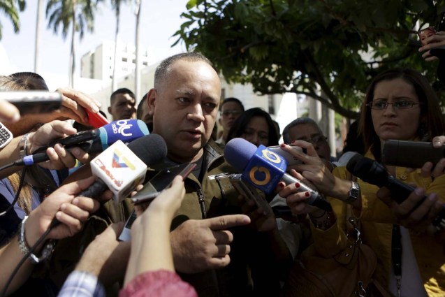 Diosdado Cabello (C), deputy of Venezuela's United Socialist Party (PSUV), talks to the media after a failed session of the National Assembly for lack of quorum in Caracas, January 12, 2016. REUTERS/Marco Bello