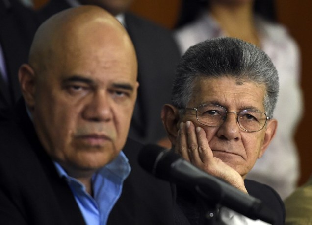The secretary general of the Democratic Unity Roundtable (MUD), Jesus "Chuo" Torrealba (L), and the president of the Venezuelan National Assembly, Henry Ramos Allup , offer a press conference in Caracas on March 8, 2016. Venezuela's opposition called for the "largest movement that has ever existed" to oust President Nicolas Maduro, vowing to pursue all means to force him from power. The opposition, which has been on a collision course with Maduro since winning control of the legislature in December, spent weeks deciding on its strategy to remove the deeply unpopular socialist president -- whether through a referendum, a constitutional amendment or the drafting of a new constitution.  AFP PHOTO / JUAN BARRETO / AFP / JUAN BARRETO