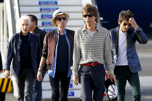 Mick Jagger, Charlie Watts, Keith Richards and Ronnie Wood of the Rolling Stones walk after landing in Havana, March 24, 2016. REUTERS/Ivan Alvarado