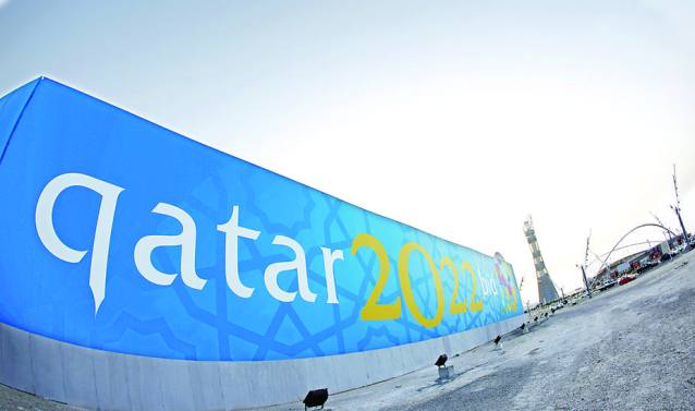 TO GO WITH AFP STORY BY FRANCOISE CHAPTAL (FILES)  -- File picture dated March 22, 2010 shows a banner for Qatar's 2022 bid to host the World Cup is seen near Aspire athletics zone in Doha. The gulf emirate, future host of the 2022 FIFA World Cup and past playground of several Arab and Asian games, is reaching for the moon as it eyes the 2020 Olympics despite seemingly insurmountable climate challenges.     AFP PHOTO/KARIM JAAFAR