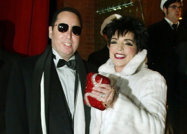 FILE - In this Sunday, Dec. 8, 2002 file photo, Liza Minnelli, right, and her husband David Gest, left, pose for photographers upon their arrival at the musical theatre "Neue Flora" in Hamburg, northern Germany. Music producer David Gest, ex-husband of Liza Minnelli, died Tuesday, April 12, 2016 at 62. (AP Photo/Christof Stache, file)