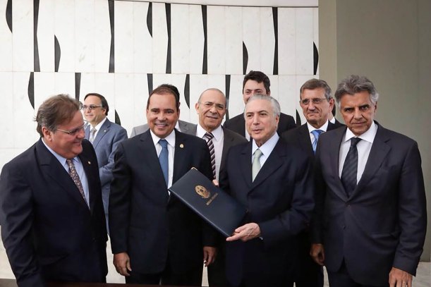 Brazilian acting President Michel Temer assumes as interim president at Jaburu Palace after the withdrawal of President Dilma Rousseff by the Senate in Brasilia on May 12, 2016. Temer, a center-right veteran with the backing of the markets, named former central bank chief Henrique Meirelles -- a champion of orthodox monetary policies -- as finance minister and former Sao Paulo governor Jose Serra as foreign minister, an adviser told AFP. / AFP PHOTO / Brazilian Vice Presidency / MARCOS CORREA / BEST QUALITY AVAILABLE