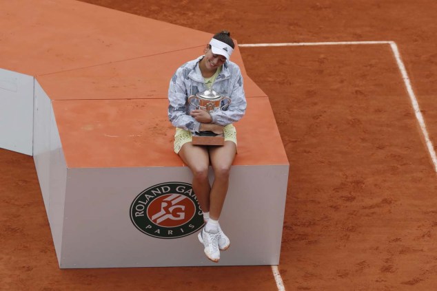 Tennis - French Open Women's Singles Final match - Roland Garros - Serena Williams of the U.S. vs Garbine Muguruza of Spain- Paris, France - 04/06/16 Garbine Muguruza reacts with her trophy. REUTERS/Gonzalo Fuentes