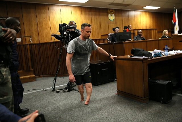 Paralympic gold medalist Oscar Pistorius walks across the courtroom without his prosthetic legs during the third day of his resentencing hearing for the 2013 murder of his girlfriend Reeva Steenkamp in the North Gauteng High Court in Pretoria, South Africa June 15, 2016. REUTERS/Alon Skuy/Pool