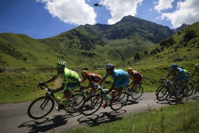 (From L) Spain's Alberto Contador, Australia's Richie Porte, Italy's Fabio Aru and USA's Tejay Van Garderen ride in the pack during the 184 km eighth stage of the 103rd edition of the Tour de France cycling race on July 9, 2016 between Pau and Bagneres-de-Luchon. / AFP PHOTO / KENZO TRIBOUILLARD