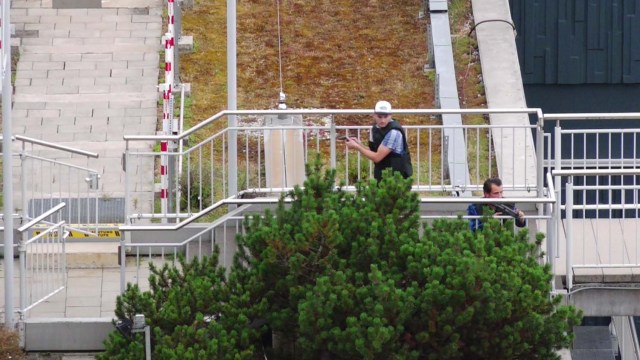 A screen grab taken from video footage shows plain clothes police officers attending the scene of a shooting rampage at the Olympia shopping mall in Munich, Germany July 22, 2016. dedinac/Marc Mueller/ handout via REUTERS NO ARCHIVES. FOR EDITORIAL USE ONLY. NOT FOR SALE FOR MARKETING OR ADVERTISING CAMPAIGNS. THIS IMAGE HAS BEEN SUPPLIED BY A THIRD PARTY. IT IS DISTRIBUTED, EXACTLY AS RECEIVED BY REUTERS, AS A SERVICE TO CLIENTS.
