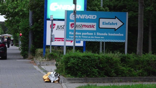 A screen grab taken from video footage shows a discarded first aid blanket lying in the street near to the Olympia shopping mall during a shooting rampage in Munich, Germany July 22, 2016. dedinac/Marc Mueller/Handout via REUTERS NO ARCHIVES. FOR EDITORIAL USE ONLY. NOT FOR SALE FOR MARKETING OR ADVERTISING CAMPAIGNS. THIS IMAGE HAS BEEN SUPPLIED BY A THIRD PARTY. IT IS DISTRIBUTED, EXACTLY AS RECEIVED BY REUTERS, AS A SERVICE TO CLIENTS.