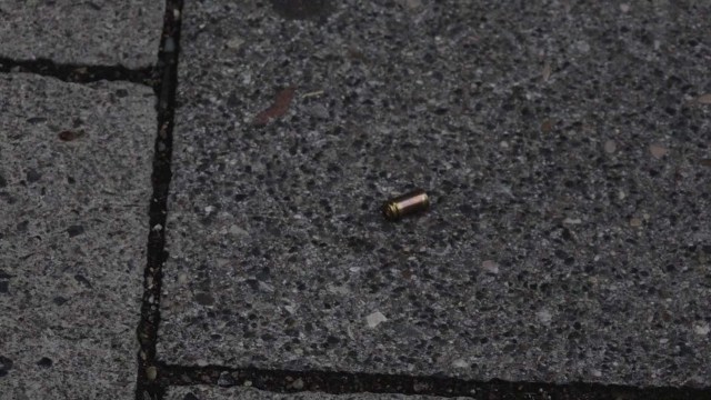 A screen grab taken from video footage shows a bullet casing lying in the street near to the Olympia shopping mall during a shooting rampage in Munich, Germany July 22, 2016. dedinac/Marc Mueller/Handout via REUTERS NO ARCHIVES. FOR EDITORIAL USE ONLY. NOT FOR SALE FOR MARKETING OR ADVERTISING CAMPAIGNS. THIS IMAGE HAS BEEN SUPPLIED BY A THIRD PARTY. IT IS DISTRIBUTED, EXACTLY AS RECEIVED BY REUTERS, AS A SERVICE TO CLIENTS.