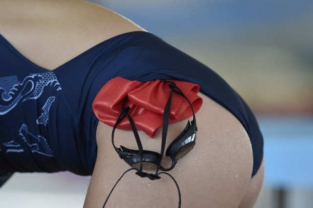 Detail of the bathing cap and goggles of British swimmer Fran Halsall, taken on July 27, 2016 at the Sports Training Centre of the Federal University of Minas Gerais in Belo Horizonte, Brazil, which Team Great Britain will use as its training camp for the upcoming Rio 2016 Olympic Games. The Rio 2016 Olympic and Paralympic Games will be held in Brazil from August 5-21 and September 7-18 respectively. / AFP PHOTO / DOUGLAS MAGNO