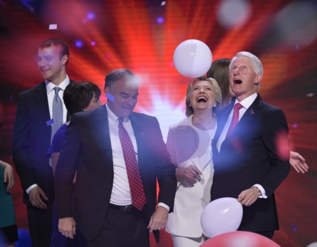 Democratic presidential nominee Hillary Clinton (2nd-R) celebrates on stage with husband former US president Bill Clinton (R), running mate Tim Kaine (2nd-L), and son-in-law Marc Mezvinsky (L) on the fourth and final night of the Democratic National Convention at Wells Fargo Center on July 28, 2016 in Philadelphia, Pennsylvania. / AFP PHOTO / SAUL LOEB