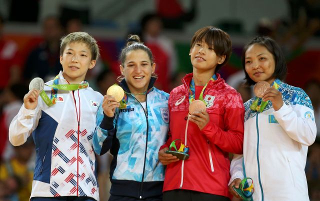 2016 Rio Olympics - Judo - Victory Ceremony - Women -48 kg Victory Ceremony - Carioca Arena 2 - Rio de Janeiro, Brazil - 06/08/2016. (L-R) Bo Kyeong Jeong (KOR) of Korea, Paula Pareto (ARG) of Argentina, Ami Kondo (JPN) of Japan and Otgontsetseg Galbadrakh (KAZ) of Kazakhstan pose with their medals. REUTERS/Toru Hanai FOR EDITORIAL USE ONLY. NOT FOR SALE FOR MARKETING OR ADVERTISING CAMPAIGNS.