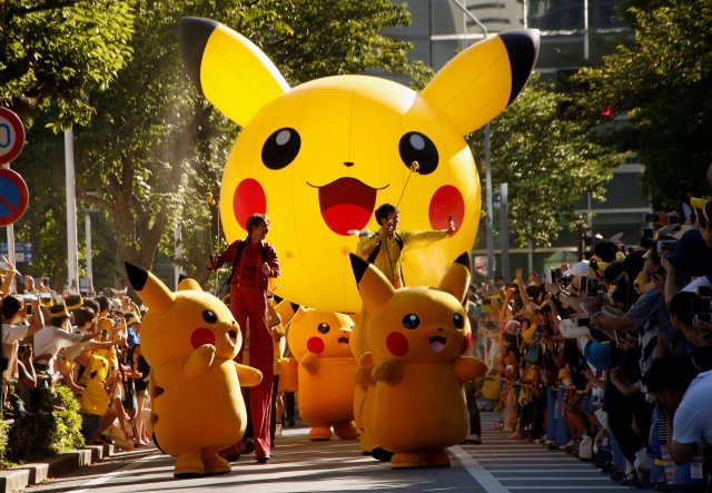 Performers wearing Pokemon's character Pikachu take part in a parade in Yokohama, Japan, August 7, 2016. REUTERS/Kim Kyung-Hoon FOR EDITORIAL USE ONLY. NO RESALES. NO ARCHIVES.