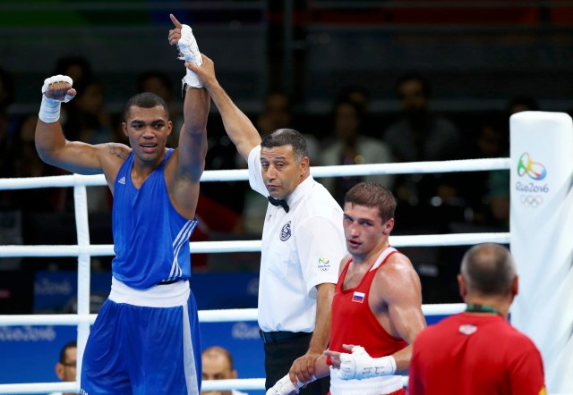 2016 Rio Olympics - Boxing - Preliminary - Boxing - Men's Light Heavy (81kg) Round of 32 Bout 28 - Riocentro - Pavilion 6 - Rio de Janeiro, Brazil - 07/08/2016. Albert Ramirez (VEN) of Venezuela celebrates after winning his bout against Petr Khamukov (RUS) of Russia. REUTERS/Peter Cziborra FOR EDITORIAL USE ONLY. NOT FOR SALE FOR MARKETING OR ADVERTISING CAMPAIGNS.