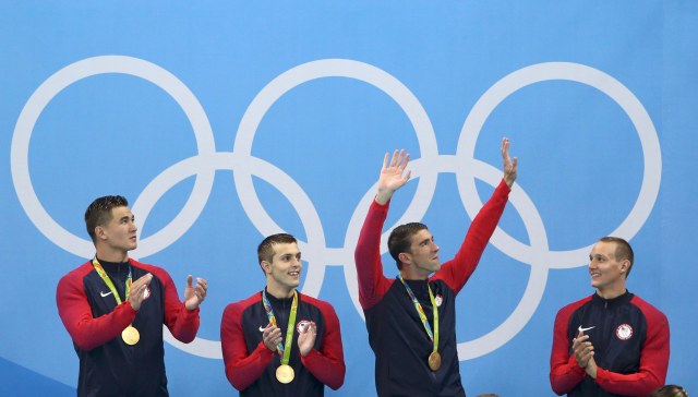 2016 Rio Olympics - Swimming - Victory Ceremony - Men's 4 x 100m Freestyle Relay Victory Ceremony - Olympic Aquatics Stadium - Rio de Janeiro, Brazil - 07/08/2016. Michael Phelps (USA) of USA, Caeleb Dressel (USA) of USA, Nathan Adrian (USA) of USA and Ryan Held (USA) of USA pose with their gold medals. REUTERS/Marcos Brindicci FOR EDITORIAL USE ONLY. NOT FOR SALE FOR MARKETING OR ADVERTISING CAMPAIGNS.
