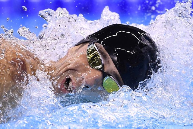 USA's Michael Phelps compete in the Men's 4x200m Freestyle Relay Final during the swimming event at the Rio 2016 Olympic Games at the Olympic Aquatics Stadium in Rio de Janeiro on August 9, 2016.   / AFP PHOTO / GABRIEL BOUYS