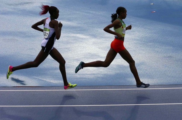 2016 Rio Olympics - Athletics - Final - Women's 10,000m Final - Olympic Stadium - Rio de Janeiro, Brazil - 12/08/2016. Almaz Ayana (ETH) of Ethiopia leads the race ahead of Yasemin Can (TUR) of Turkey.  REUTERS/David Gray  FOR EDITORIAL USE ONLY. NOT FOR SALE FOR MARKETING OR ADVERTISING CAMPAIGNS.