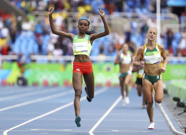 2016 Rio Olympics - Athletics - Final - Women's 10,000m Final - Olympic Stadium - Rio de Janeiro, Brazil - 12/08/2016. Almaz Ayana (ETH) of Ethiopia crosses the finish line first to set a new world record.  REUTERS/Lucy Nicholson FOR EDITORIAL USE ONLY. NOT FOR SALE FOR MARKETING OR ADVERTISING CAMPAIGNS.