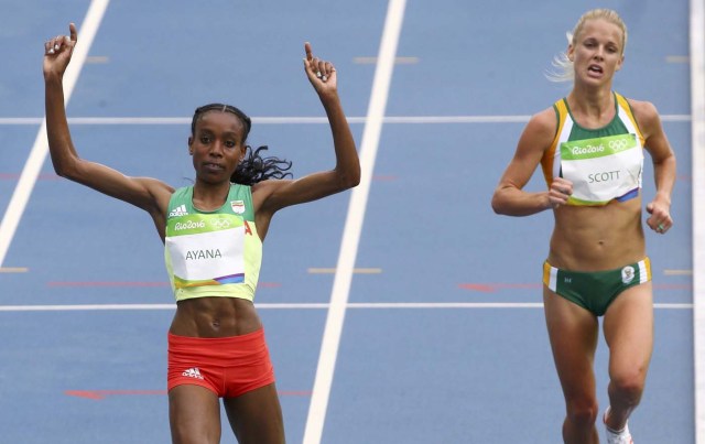 2016 Rio Olympics - Athletics - Final - Women's 10,000m Final - Olympic Stadium - Rio de Janeiro, Brazil - 12/08/2016. Almaz Ayana (ETH) of Ethiopia crosses the finish line first to set a new world record.   REUTERS/David Gray  FOR EDITORIAL USE ONLY. NOT FOR SALE FOR MARKETING OR ADVERTISING CAMPAIGNS.