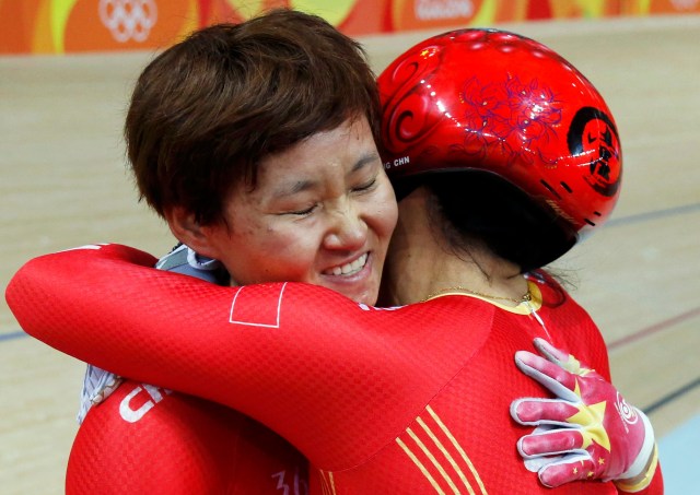 2016 Rio Olympics - Cycling Track - Final - Women's Team Sprint Final Gold Race - Rio Olympic Velodrome - Rio de Janeiro, Brazil - 12/08/2016. Zhong Tianshi (CHN) of China and Gong Jinjie (CHN) of China celebrate. REUTERS/Eric Gaillard TPX IMAGES OF THE DAY. FOR EDITORIAL USE ONLY. NOT FOR SALE FOR MARKETING OR ADVERTISING CAMPAIGNS.