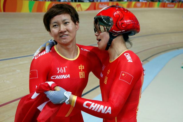 2016 Rio Olympics - Cycling Track - Final - Women's Team Sprint Final Gold Race - Rio Olympic Velodrome - Rio de Janeiro, Brazil - 12/08/2016. Zhong Tianshi (CHN) of China and Gong Jinjie (CHN) of China celebrate. REUTERS/Eric Gaillard FOR EDITORIAL USE ONLY. NOT FOR SALE FOR MARKETING OR ADVERTISING CAMPAIGNS.