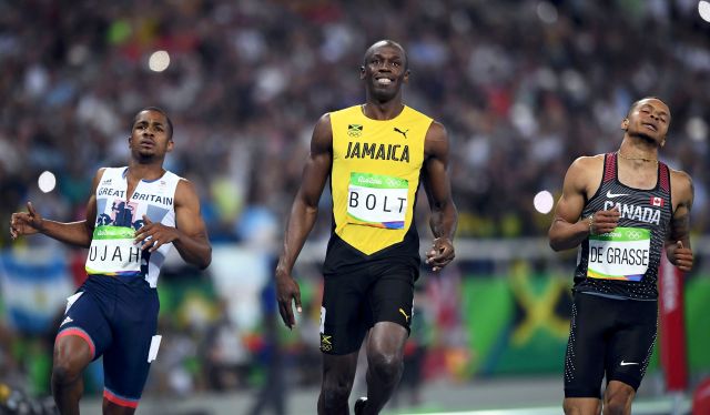2016 Rio Olympics - Athletics - Semifinal - Men's 100m Semifinals - Olympic Stadium - Rio de Janeiro, Brazil - 14/08/2016. Usain Bolt (JAM) of Jamaica, Chijindu Ujah (GBR) of Britain and Andre De Grasse (CAN) of Canada compete REUTERS/Dylan Martinez FOR EDITORIAL USE ONLY. NOT FOR SALE FOR MARKETING OR ADVERTISING CAMPAIGNS.