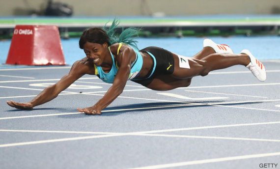 RIO DE JANEIRO, BRAZIL - AUGUST 15: Shaunae Miller of the Bahamas dives over the finish line to win the gold medal in the Women's 400m Final on Day 10 of the Rio 2016 Olympic Games at the Olympic Stadium on August 15, 2016 in Rio de Janeiro, (Photo by Alexander Hassenstein/Getty Images)