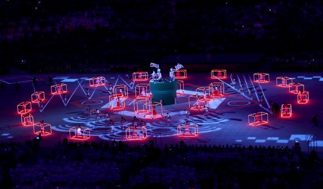 2016 Rio Olympics - Closing Ceremony - Maracana - Rio de Janeiro, Brazil - 21/08/2016. Performers dance inside and around cubed structures. REUTERS/Yves Herman FOR EDITORIAL USE ONLY. NOT FOR SALE FOR MARKETING OR ADVERTISING CAMPAIGNS.