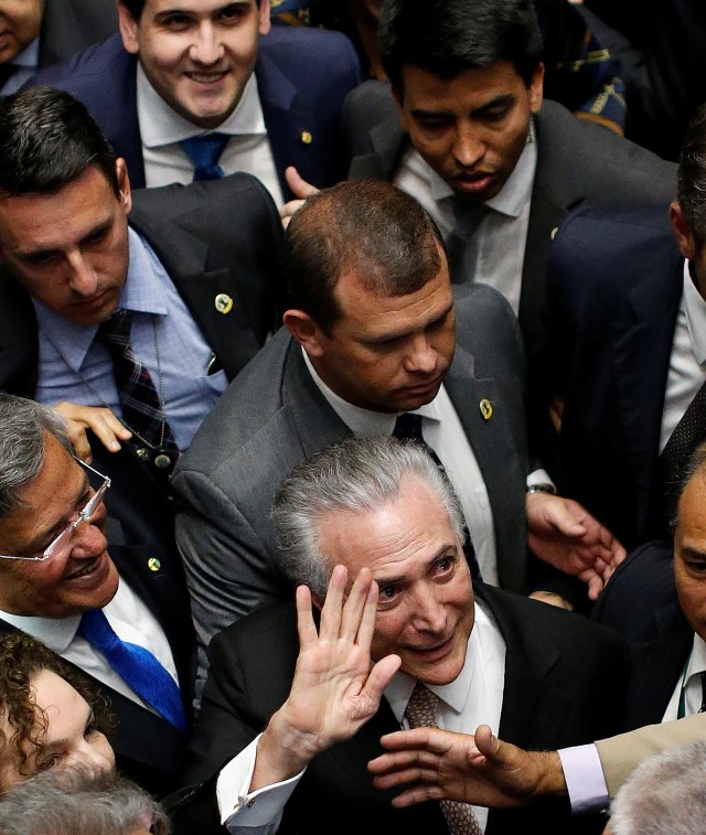 Brazil's new President Michel Temer leaves the presidential inauguration ceremony after Brazil's Senate removed President Dilma Rousseff in Brasilia, Brazil, August 31, 2016. REUTERS/Ueslei Marcelino