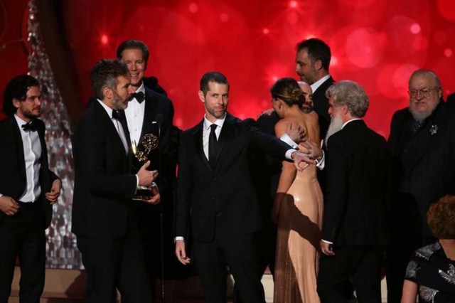 Executive Producers David Benioff (2nd from L) and D.B. Weiss (C) accept the award for Oustanding Drama Series for "Game of Thrones" with cast and crew including author and producer George R.R. Martin (R) at the 68th Primetime Emmy Awards in Los Angeles, California, U.S., September 18, 2016. REUTERS/Mike Blake